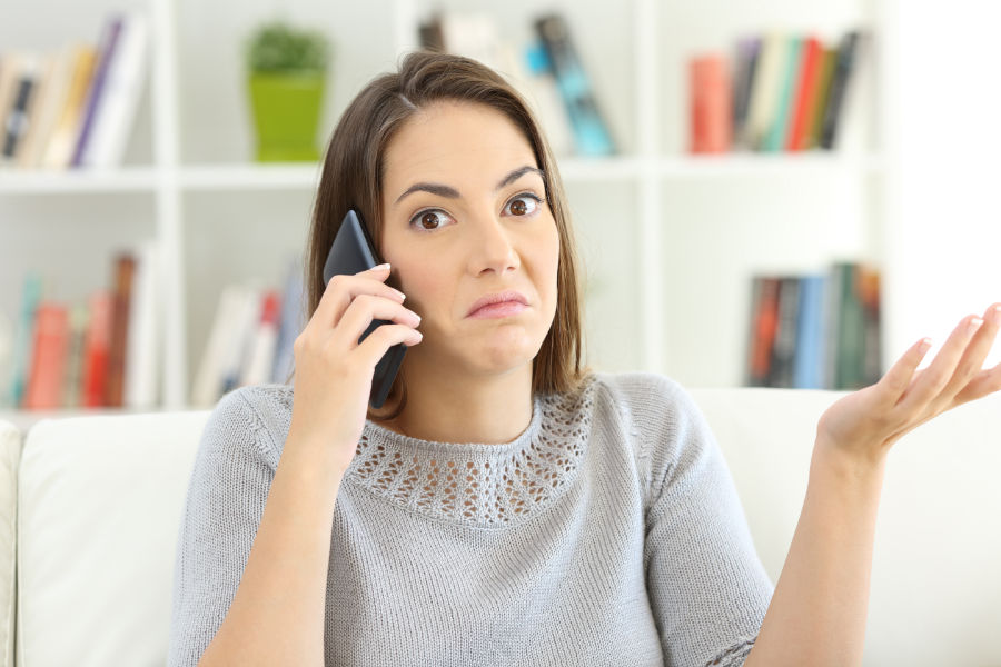 Woman on the phone trying to figure out why her furnace won't stop running.